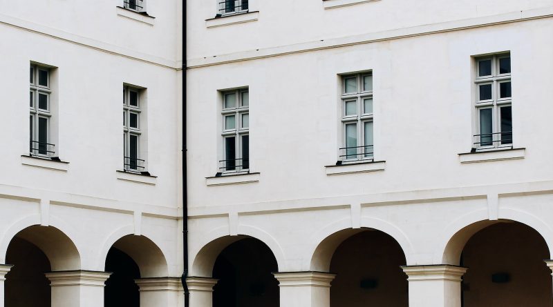 a white building with arched windows